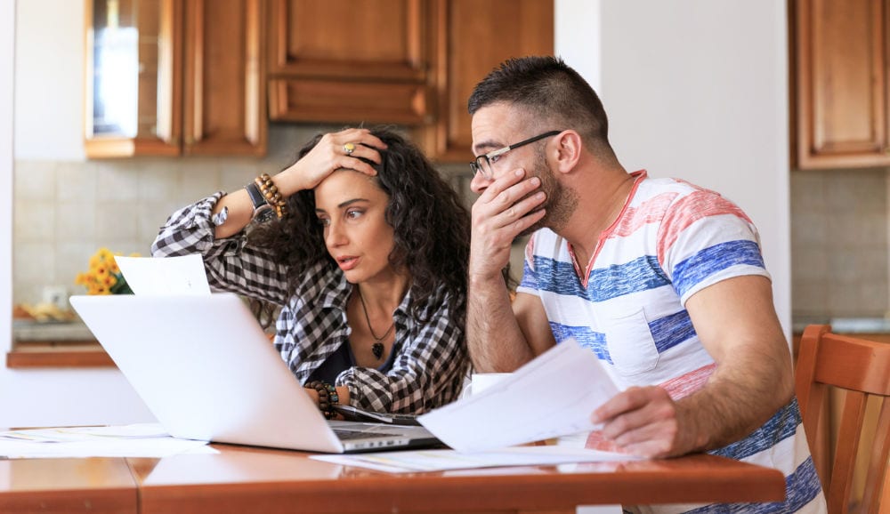 couple stressed about energy bills from furnace running constantly in olympia, WA