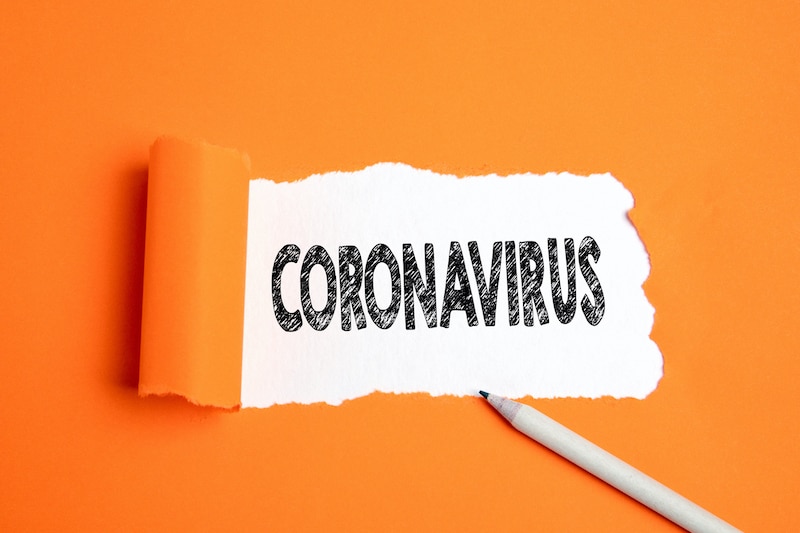 Coronavirus Text under torn paper