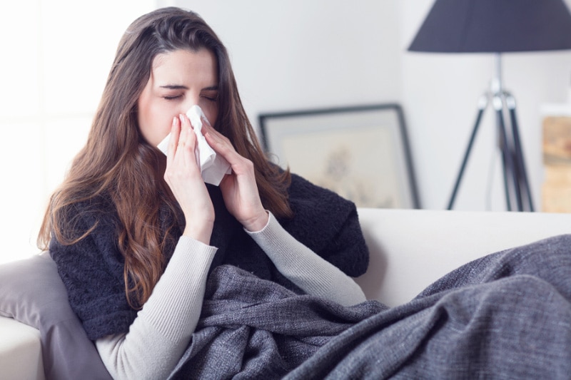 Woman Blowing Nose