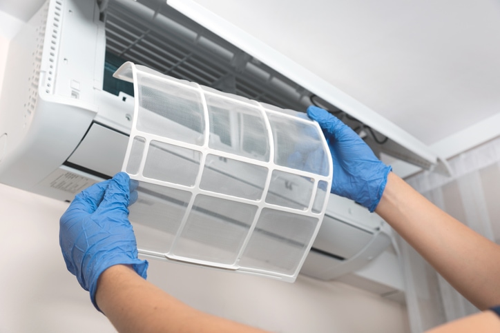 Modern air conditioner unit service. Cleaning the filter, fumigation. Air conditioner service.