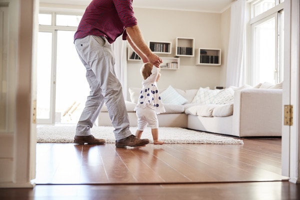 man walking his baby around their Olympia home